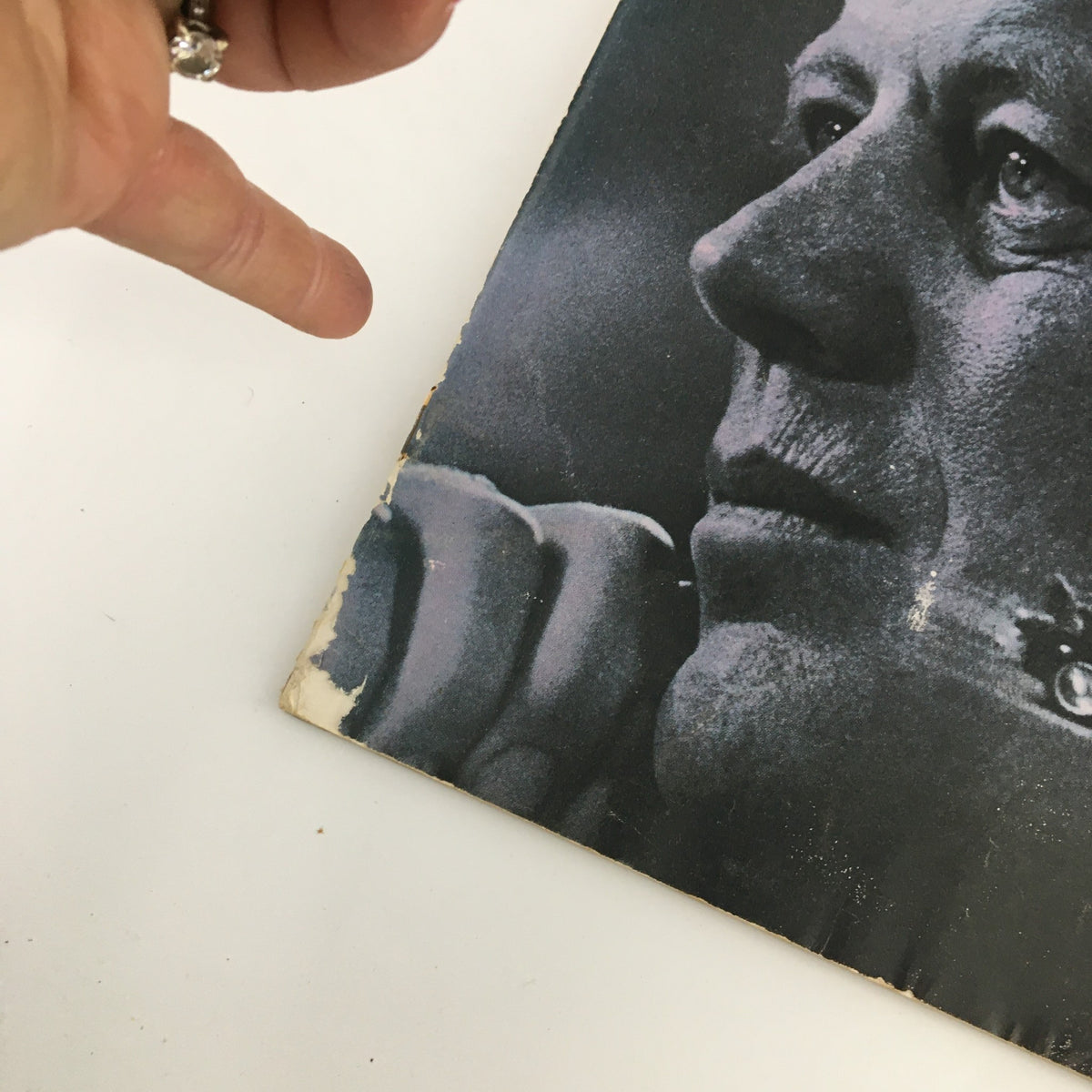 Angle view of The Saturday Evening Post cover from December 2, 1967, showing a close-up of John F. Kennedy with notable wear on the edge, highlighting the article on assassins.
