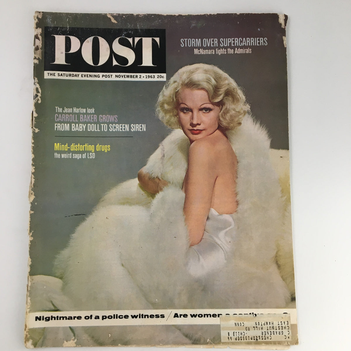 Vintage cover of The Saturday Evening Post from November 2, 1963 featuring the Jean Harlow look with a striking image of actress Carroll Baker draped in white fur.