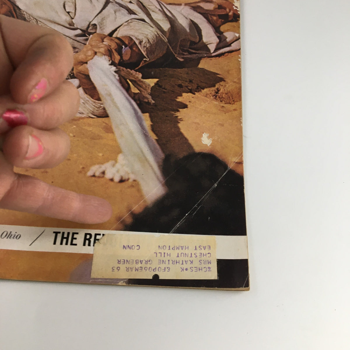 Detailed shot of The Saturday Evening Post March 9 1963, highlighting the Crime Town USA article with visible wear, address label, and a hand pointing at the magazine.