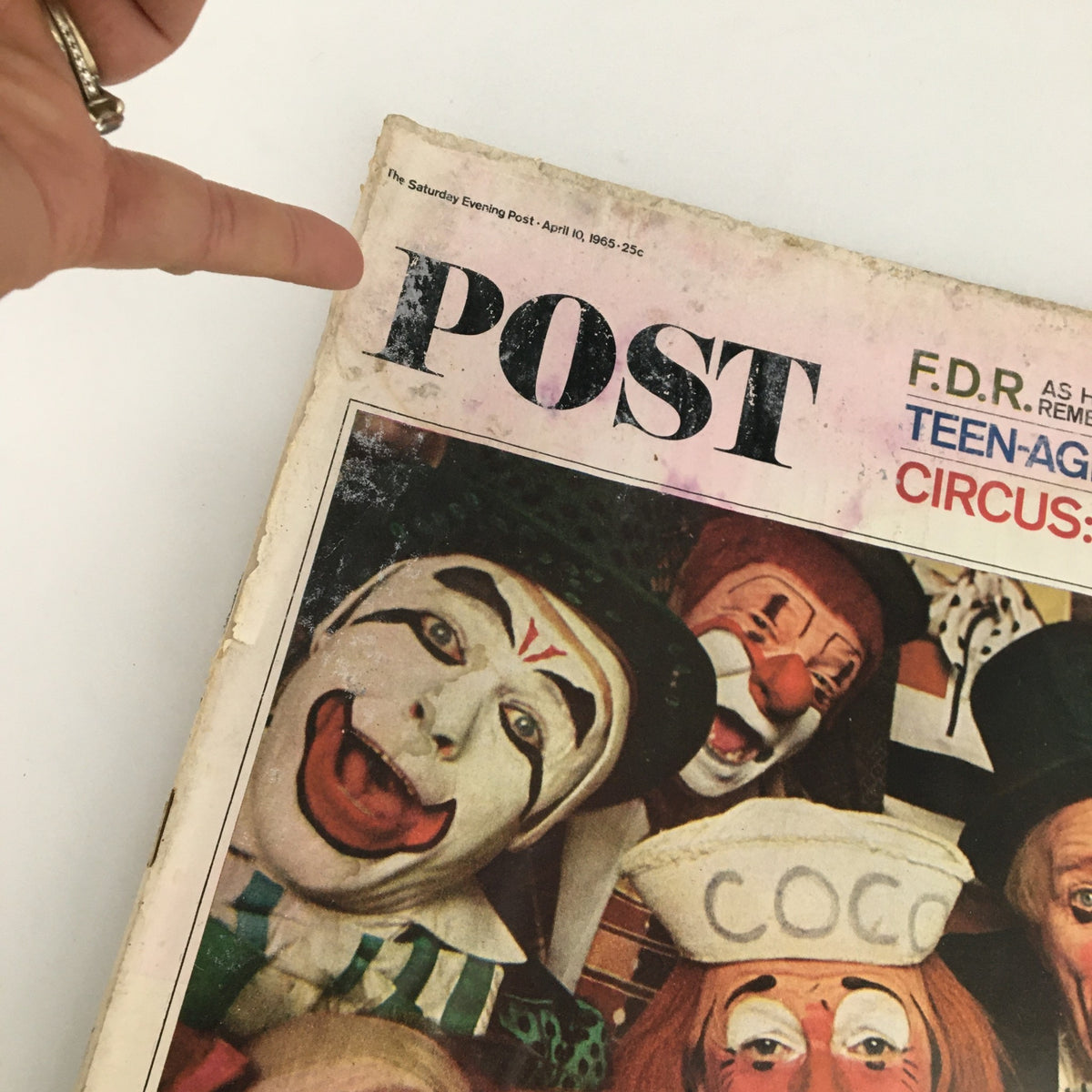 Close-up of The Saturday Evening Post April 10 1965 cover showcasing multiple clowns, emphasizing the vintage design and theme.
