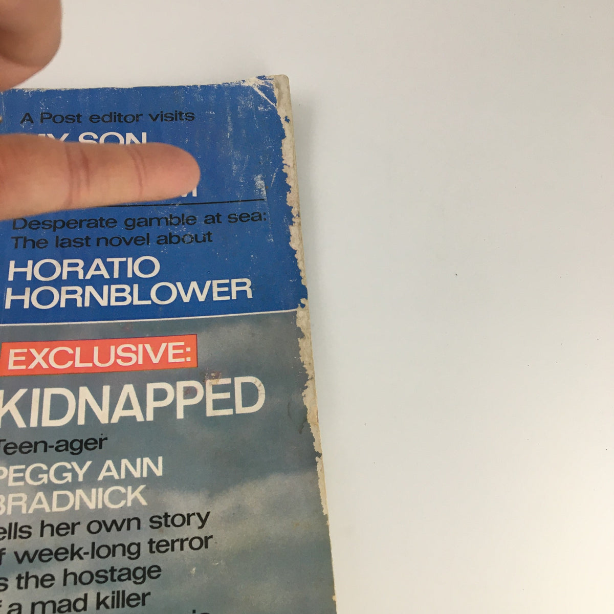 Another angle of The Saturday Evening Post July 16, 1966, showing the top of the cover featuring Peggy Ann Bradnick's story 'Kidnapped' and additional text about Vietnam.