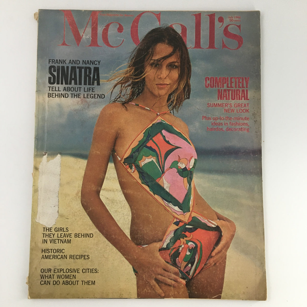 Cover of VTG McCall's Magazine July 1968 featuring Frank and Nancy Sinatra. The vintage magazine showcases a model in a colorful swimsuit on the beach, alongside titles highlighting personal stories about the Sinatras and historic American recipes.