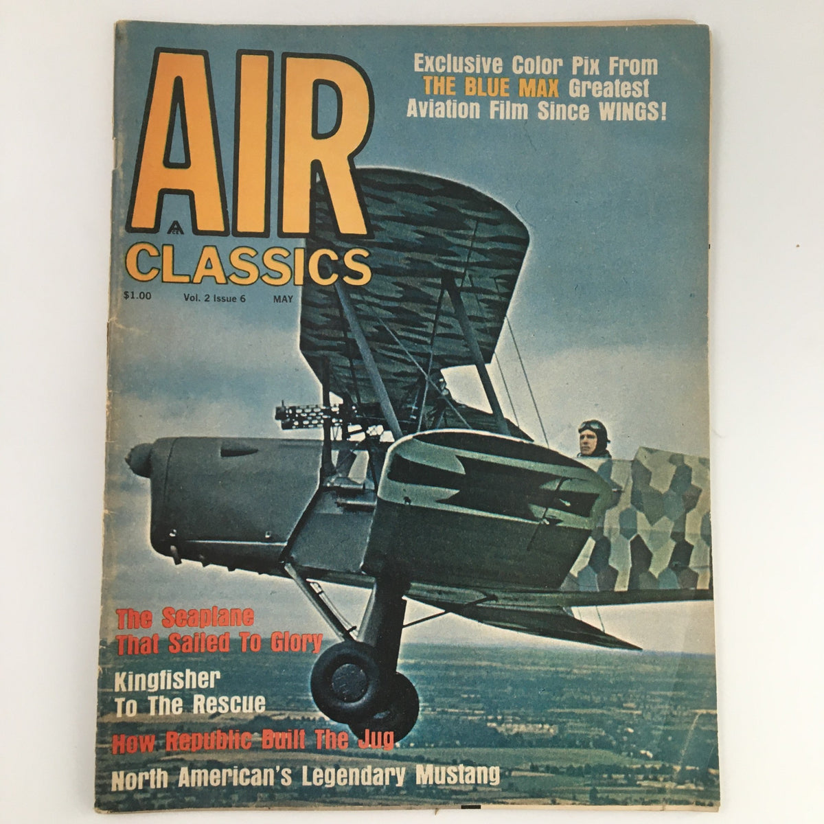 Cover of VTG Air Classics Magazine May 1965 Vol 2 #6 featuring The Blue Max. The magazine displays an airplane flying above a scenic landscape with bold yellow text highlighting the title.