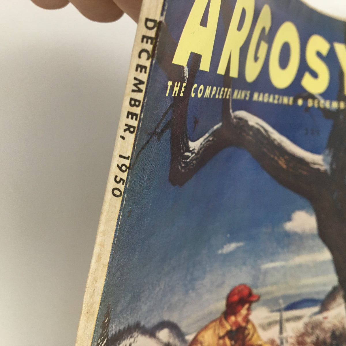 Side view image of the spine of VTG Argosy Magazine December 1950, showing the publication date and iconic cover design.