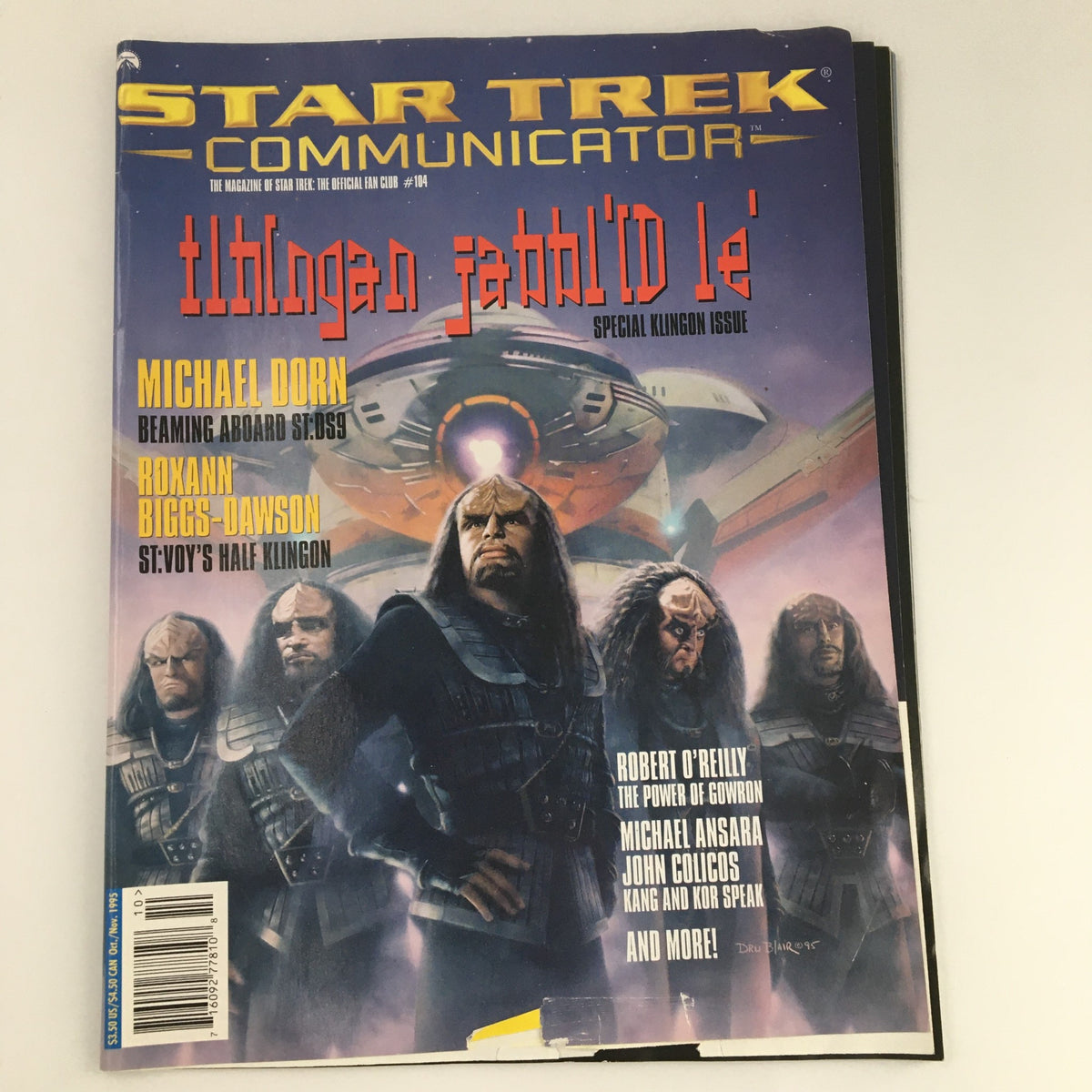 Star Trek Communicator Magazine - October November 1995 featuring Michael Dorn on the cover, along with Roxann Biggs-Dawson and other Klingon characters, showcasing a vibrant and colorful design with the iconic Star Trek starship in the background.