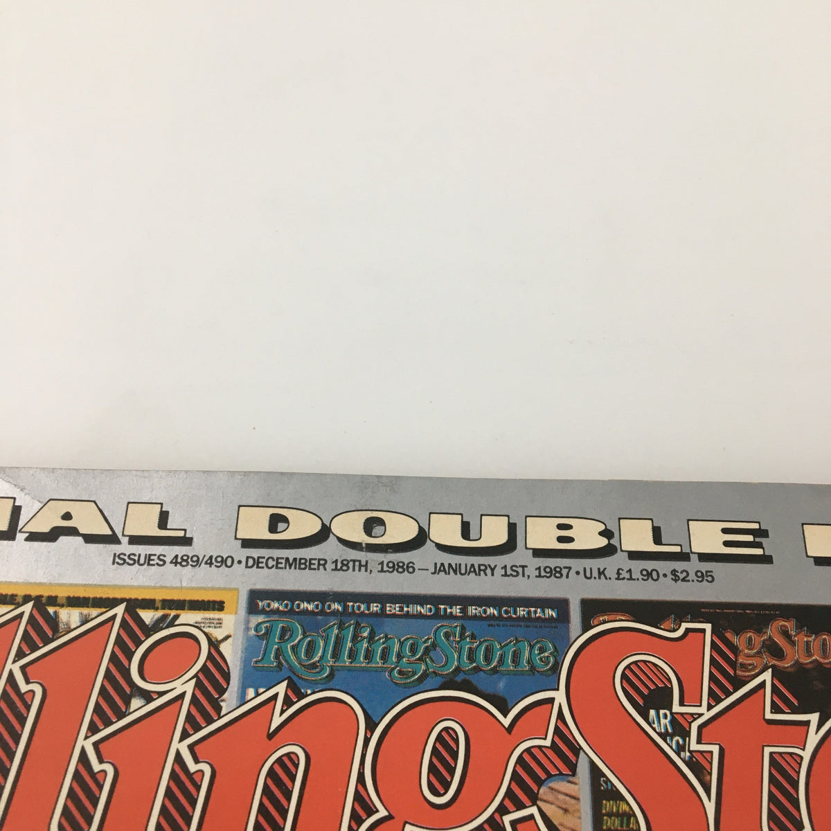 Top border detail of Rolling Stone Magazine December 18, 1986, indicating it's a special double issue, covering significant events from December 1986 to January 1987.