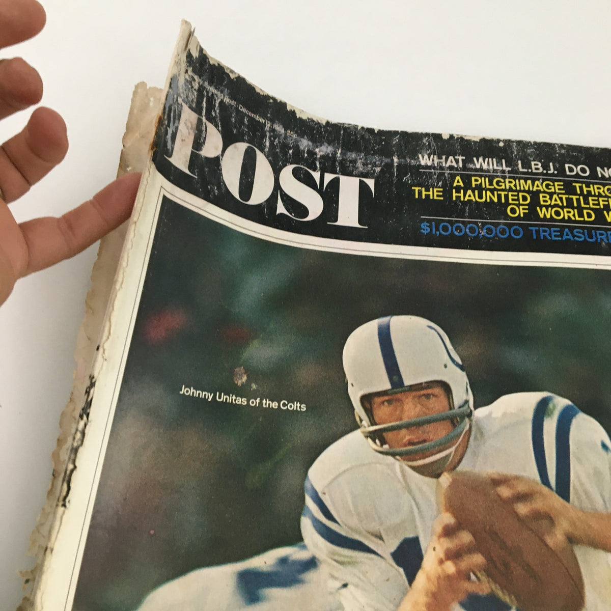 Detailed view of the cover of The Saturday Evening Post, December 12, 1964, highlighting Johnny Unitas of the Colts, with visible wear reflecting its vintage status.