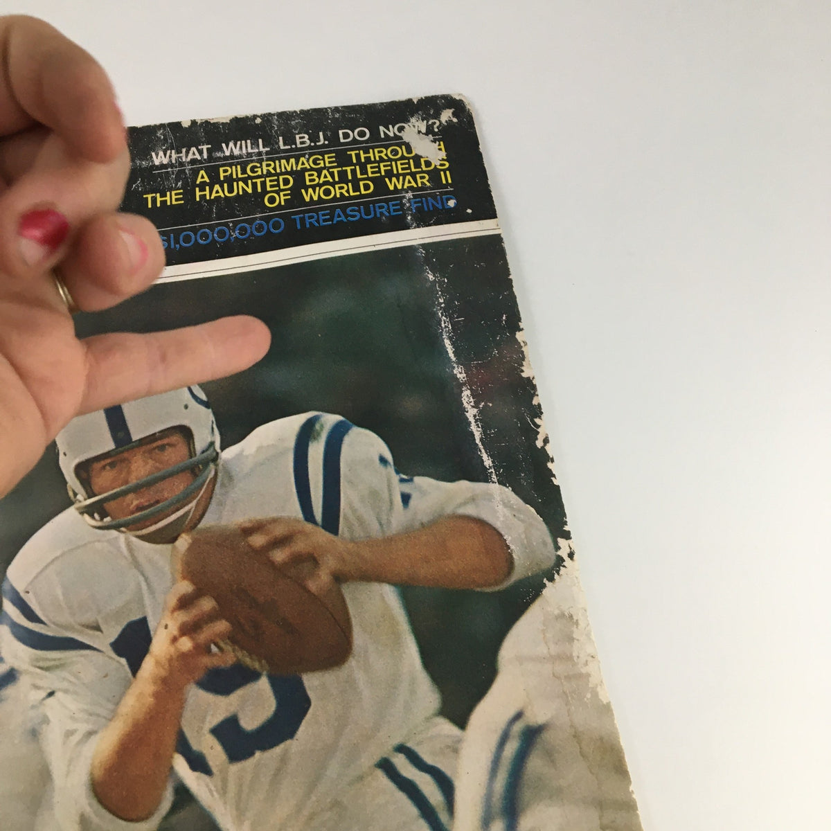 The Saturday Evening Post December 12, 1964 cover featuring NFL star Johnny Unitas of the Colts with visible wear and tear.