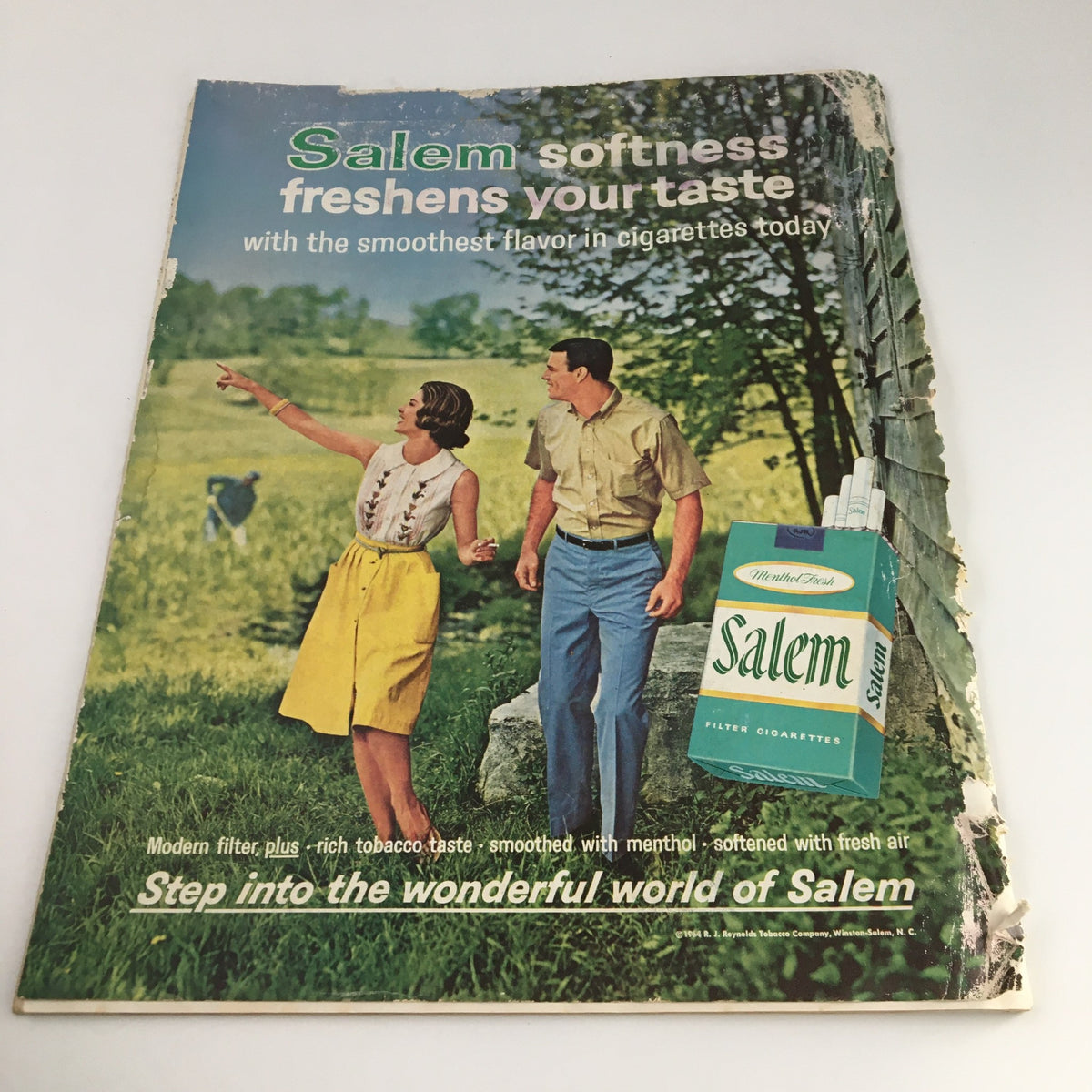 Vintage advertisement for Salem cigarettes in The Saturday Evening Post December 12, 1964, showcasing a couple outdoors.