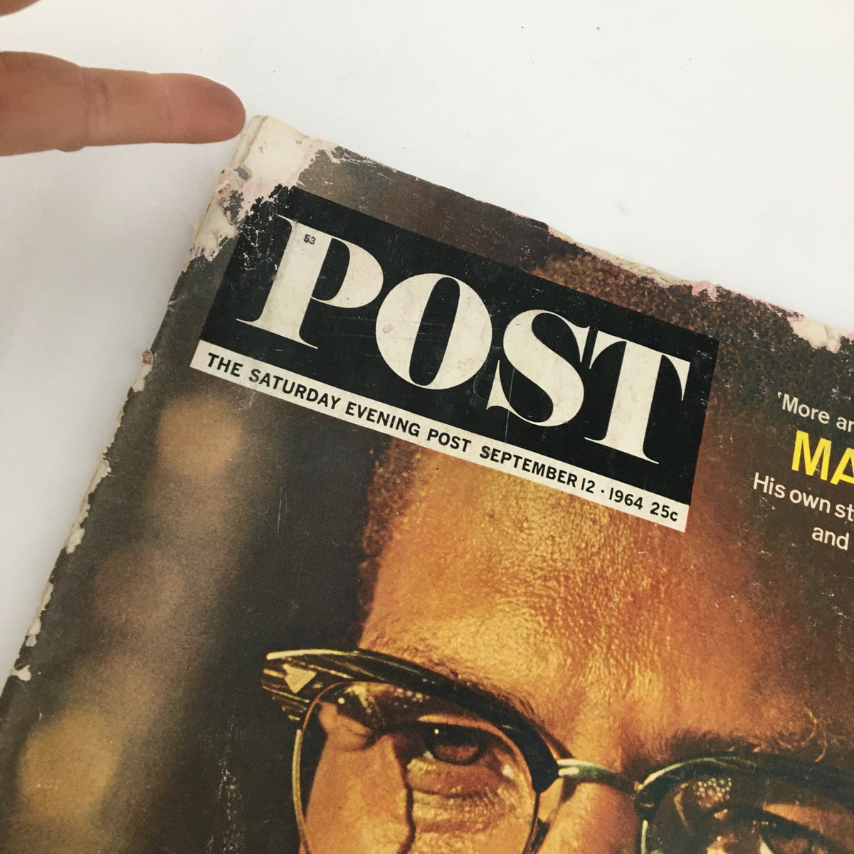 The Saturday Evening Post September 12 1964 showing a detailed view of Malcolm X's face on the cover, with emphasis on the magazine's title and date, illustrating its vintage appeal.