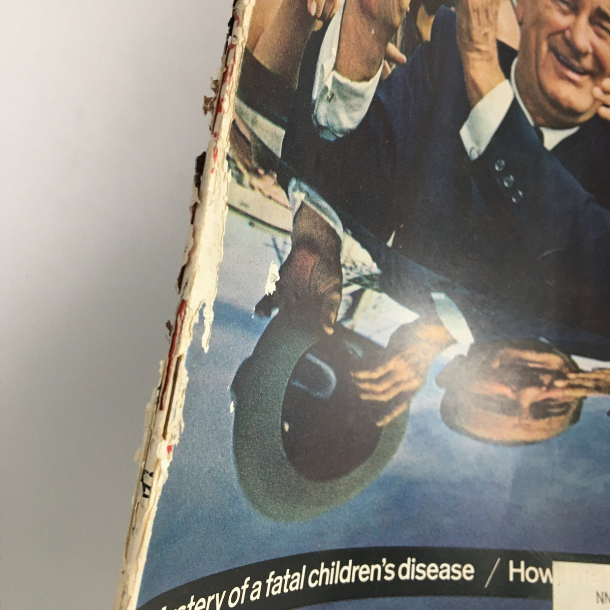 Side view of The Saturday Evening Post from October 31, 1964, illustrating wear and tear, emphasizing its significance as a collectible item focused on Lyndon B. Johnson.
