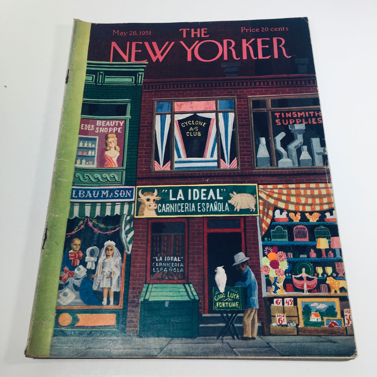 Cover of The New Yorker magazine from May 26, 1951, featuring a colorful street scene with shops, including 'Beauty Shoppe', 'La Ideal Carniceria Española', and 'Cyclone A's Club', showcasing vibrant storefronts and a character interacting with an owl. The magazine is priced at 20 cents.
