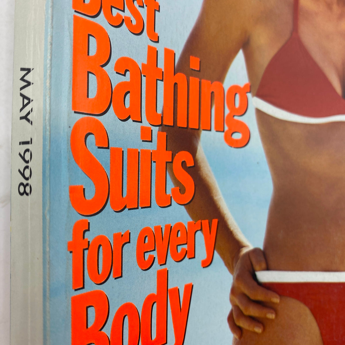 Close-up of the Vogue Magazine May 1998 cover showcasing the text 'Best Bathing Suits for every Body' in bold red font.