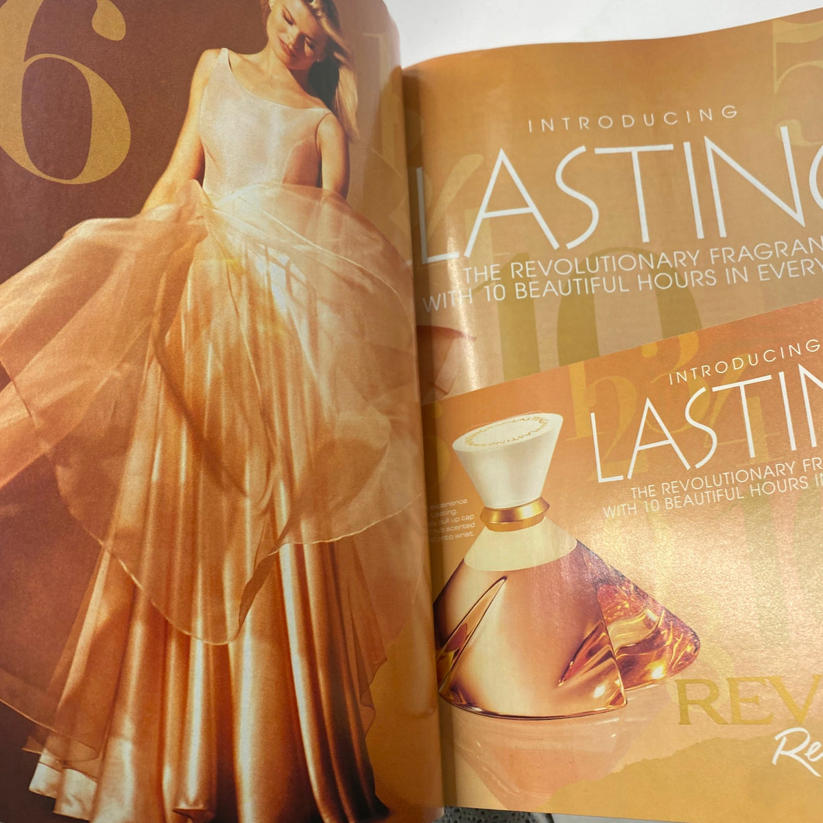 Advertisement page within Vogue Magazine November 1995 introducing a new fragrance, featuring a model in an elegant dress, emphasizing beauty and style.