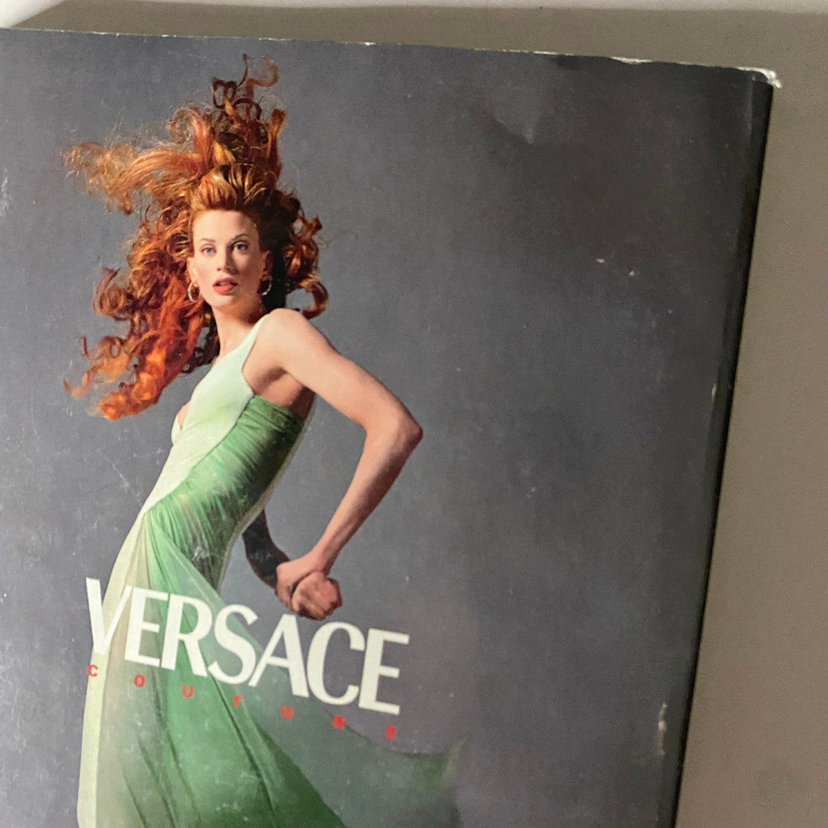 Cover of Vogue Magazine November 1995 featuring Kirsty Hume in a green dress with a Versace Couture design, showcasing mid-90s fashion trends.