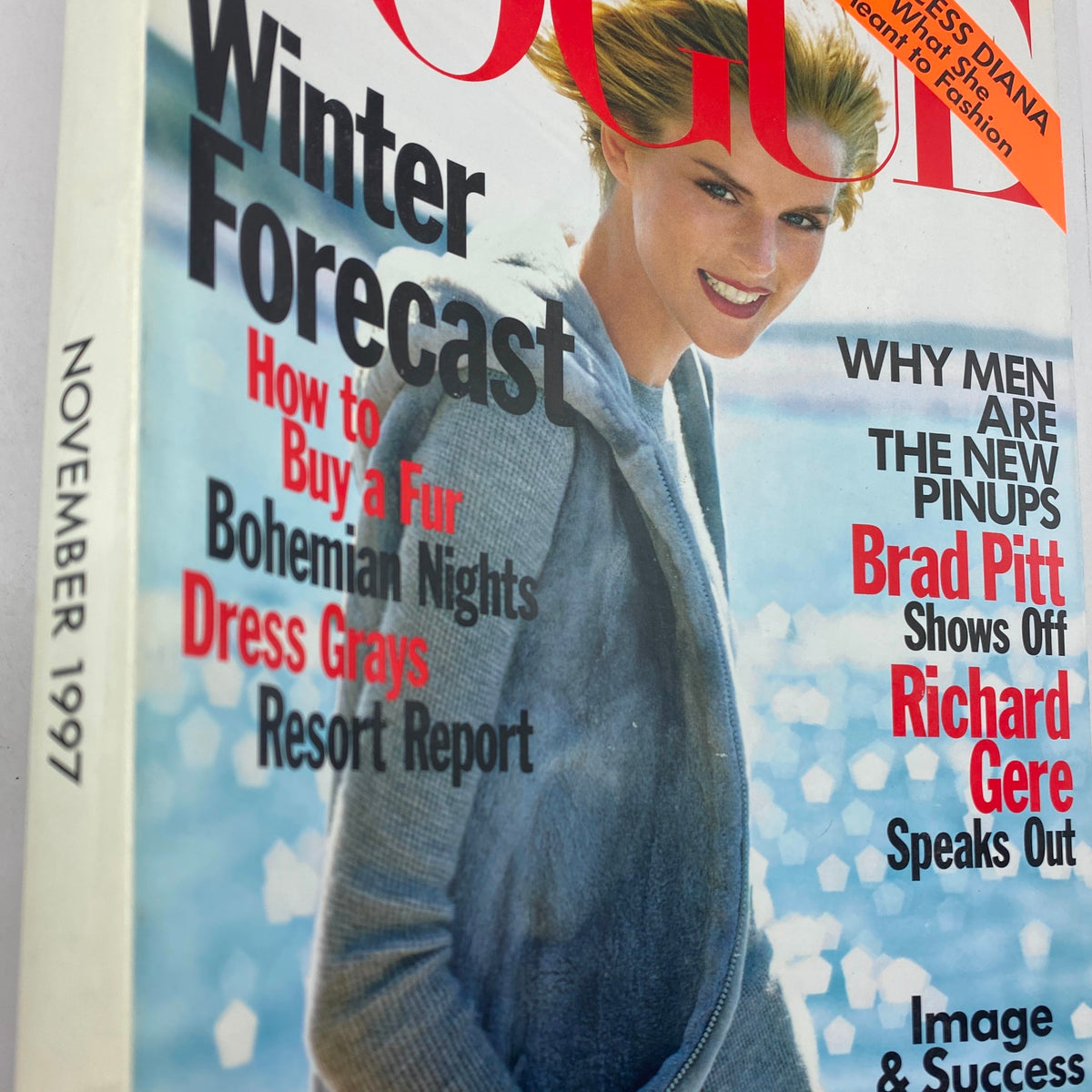 Close-up of the Vogue Magazine November 1997 cover showing details about the winter forecast and fashion topics including fur buying, Brad Pitt, and Richard Gere.