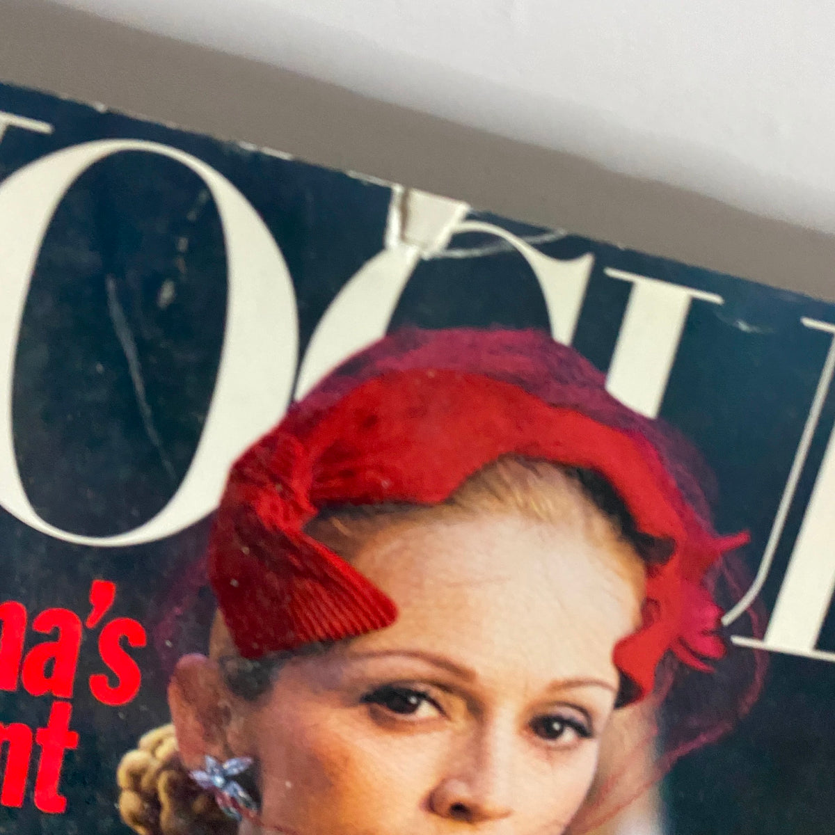 Close-up view of Vogue Magazine October 1996 cover featuring Madonna, showcasing her styled hair and fashion-forward look, emphasizing her role in the magazine.