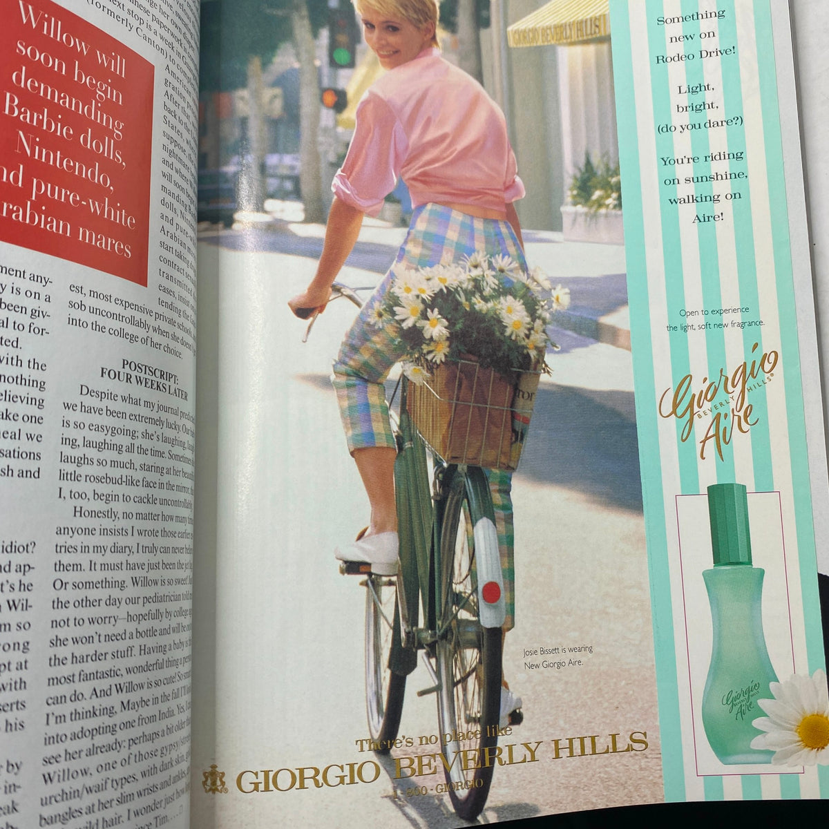Giorgio Beverly Hills fragrance advertisement featured in Vogue Magazine October 1996, showcasing a model riding a bicycle with flowers, promoting a light, bright style.