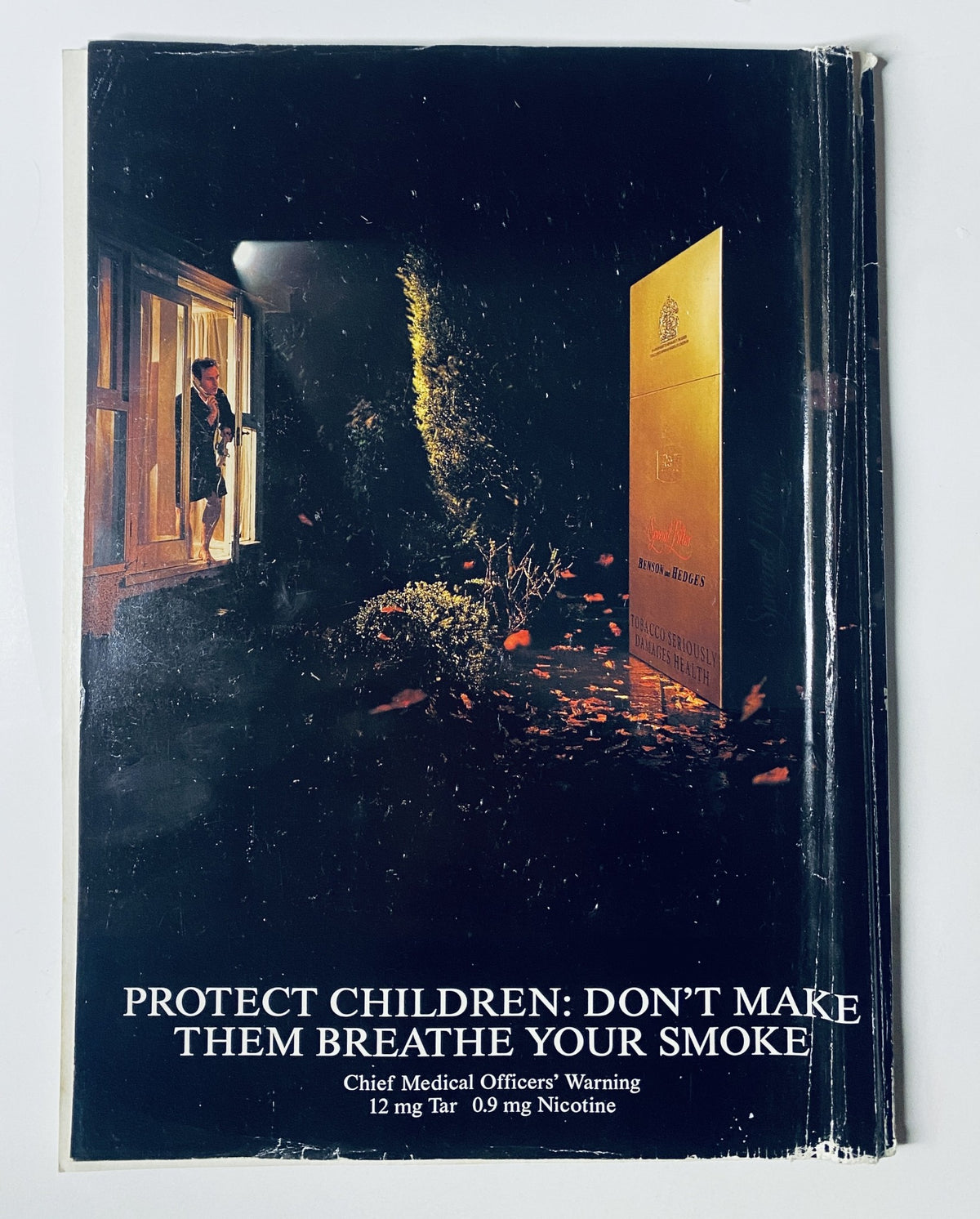 Car Magazine July 1997 back cover displaying a public health message against smoking, featuring a woman standing by a window with an anti-smoking warning.