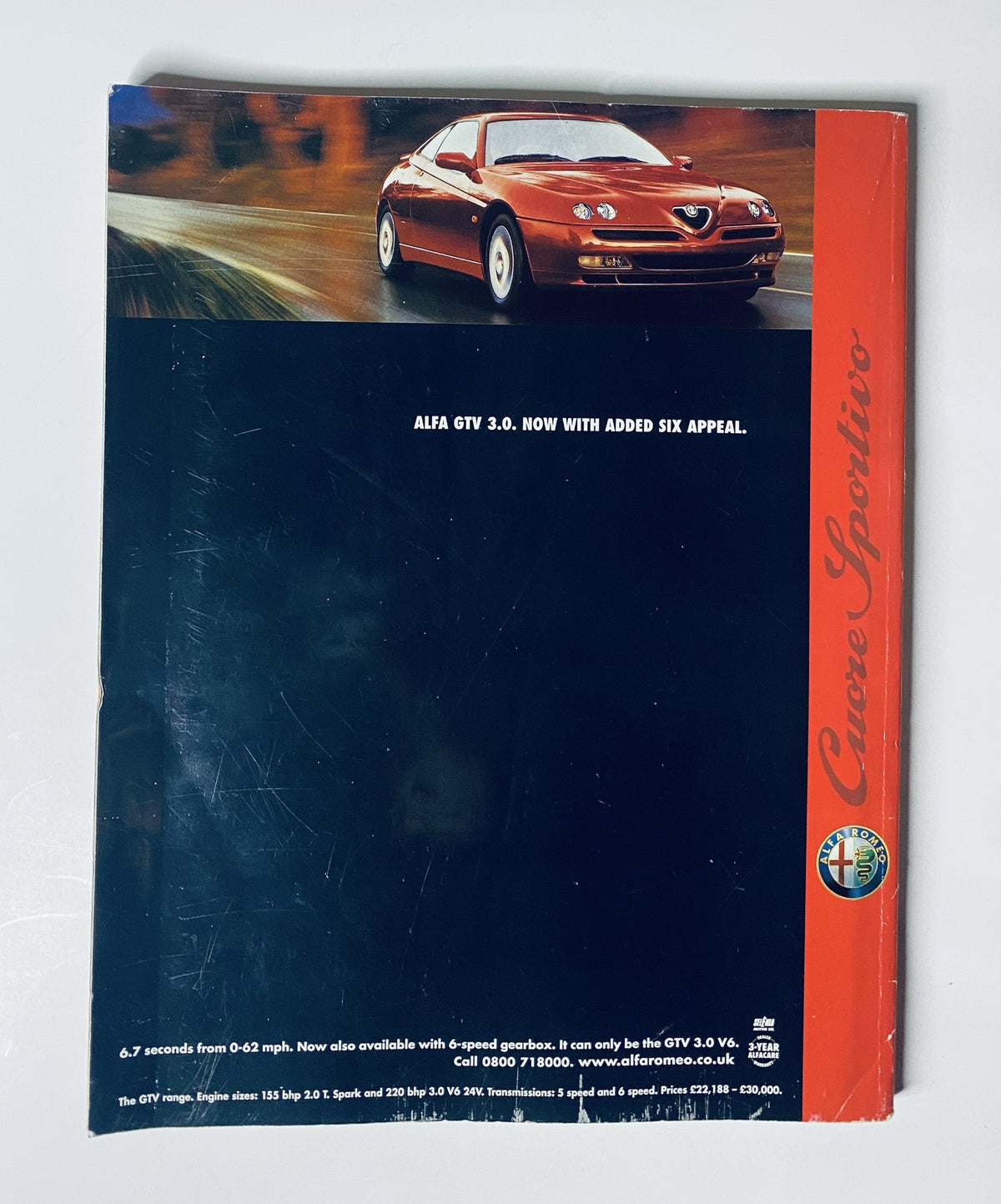 Car Magazine October 1999 cover showcasing the Alfa GTV 3.0, promoting its six-cylinder performance and stylish exterior.