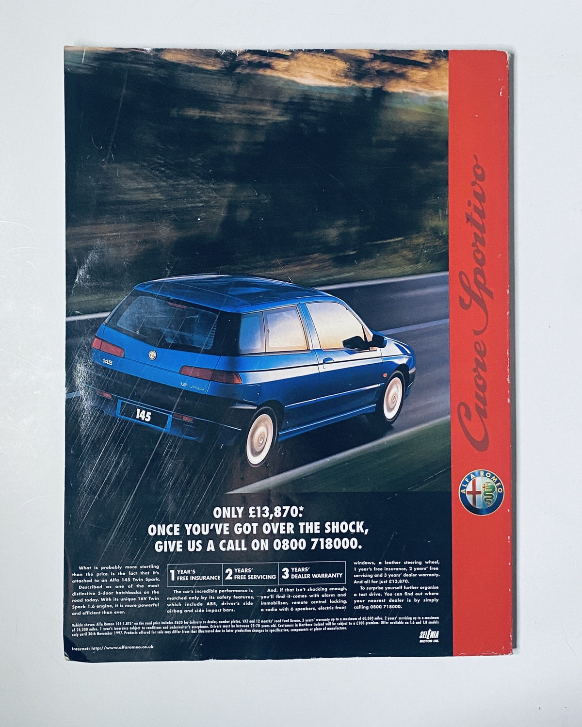 Back cover of CAR Magazine November 1997 showcasing an advertisement for the Alfa Romeo Cuore Sportivo, highlighting its price and features.