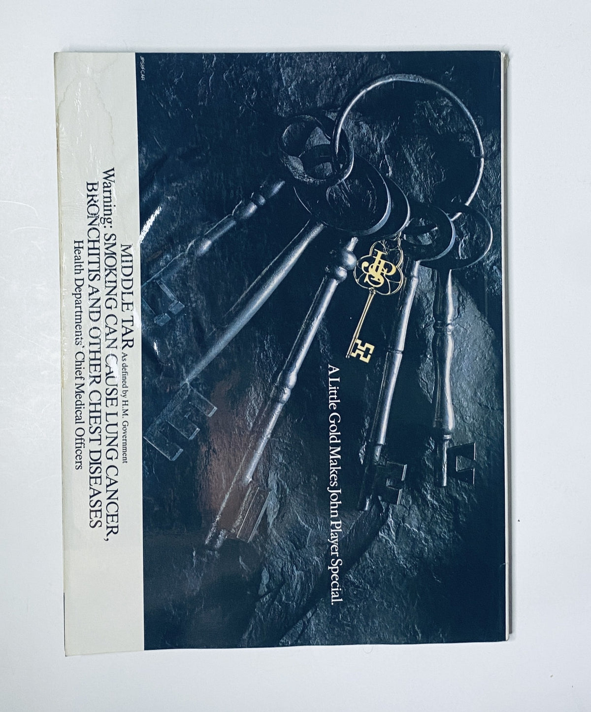 Back cover of CAR Magazine, November 1987, featuring a photo of keys with a reminder about potential health risks associated with vehicles, emphasizing the magazine's focus on automotive topics.