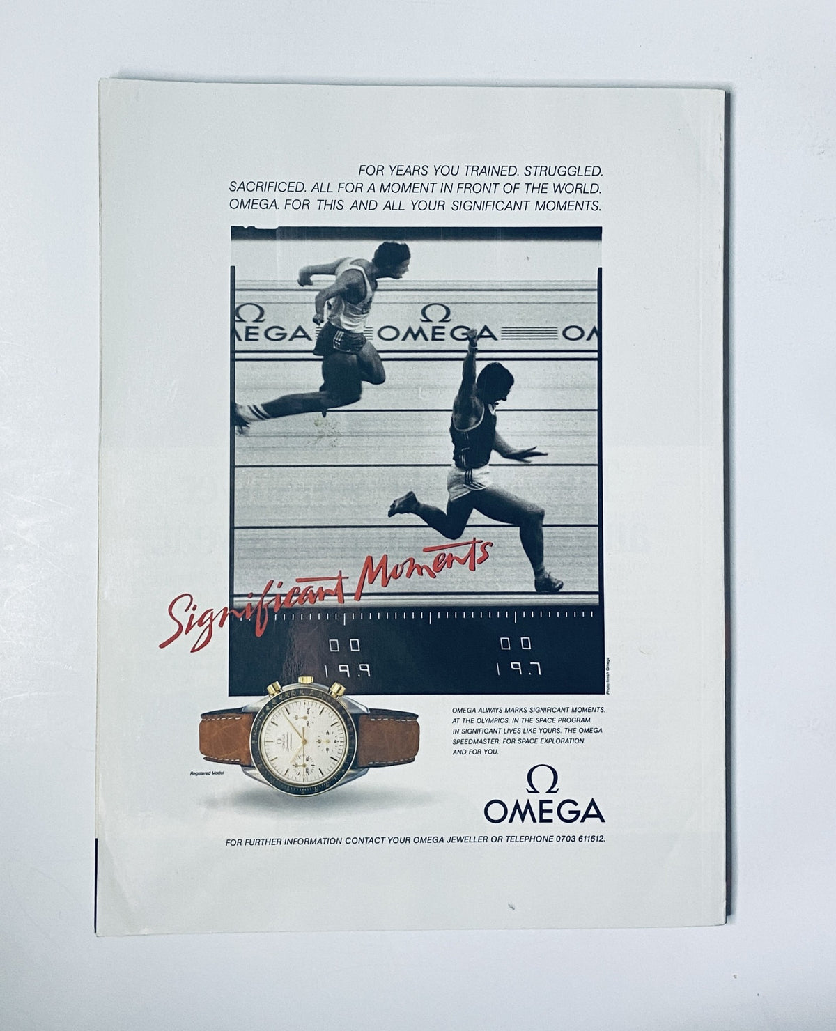 Vintage Omega watch advertisement featuring two athletes racing, emphasizing the theme 'Significant Moments,' accompanied by the iconic Omega logo.