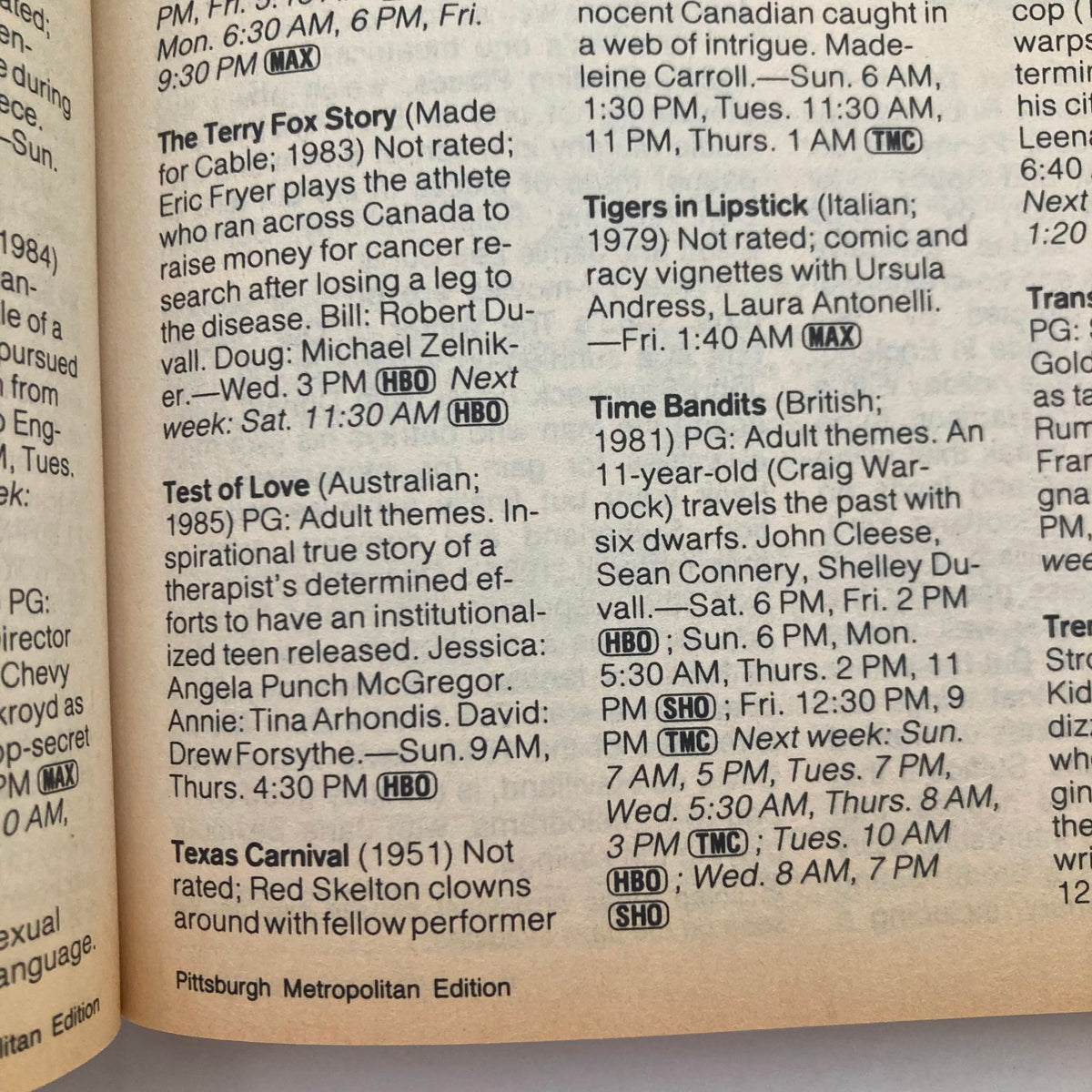 Interior page of the TV Guide Magazine from April 4, 1987, detailing movie listings and programming, including titles like The Terry Fox Story and Time Bandits. Pittsburgh Metro Edition, showcasing vintage television content.