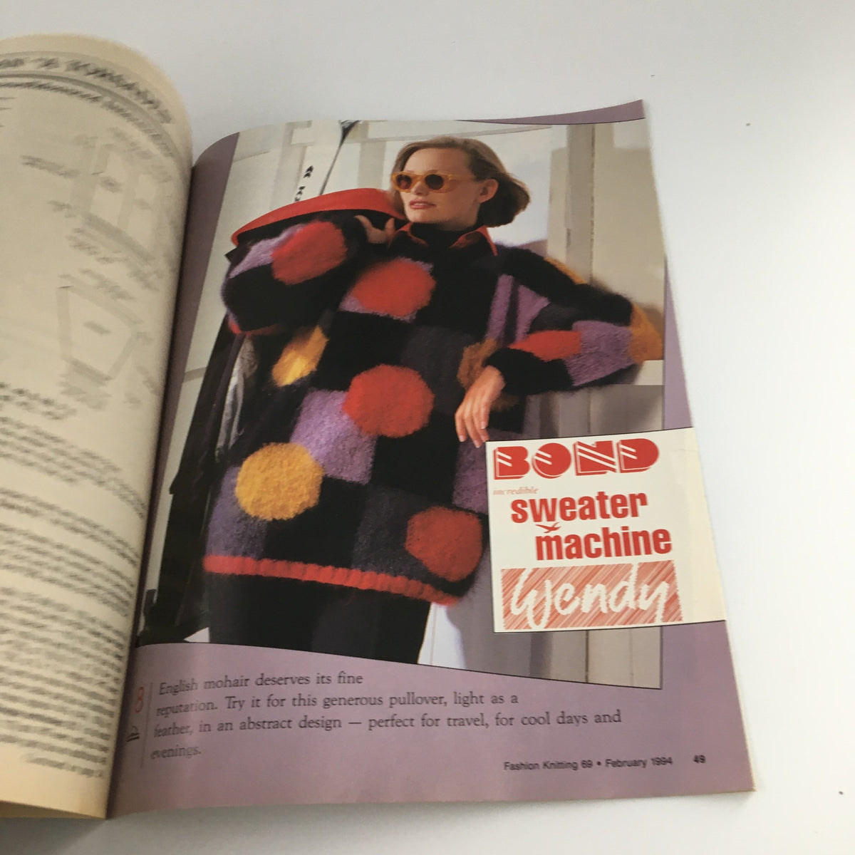 Image from Fashion Knitting Magazine February 1994 #69 featuring a woman wearing a colorful oversized pullover with large polka dots, showcasing trendy knitting fashion of the 90s. This issue includes exclusive patterns and techniques for knitting enthusiasts.