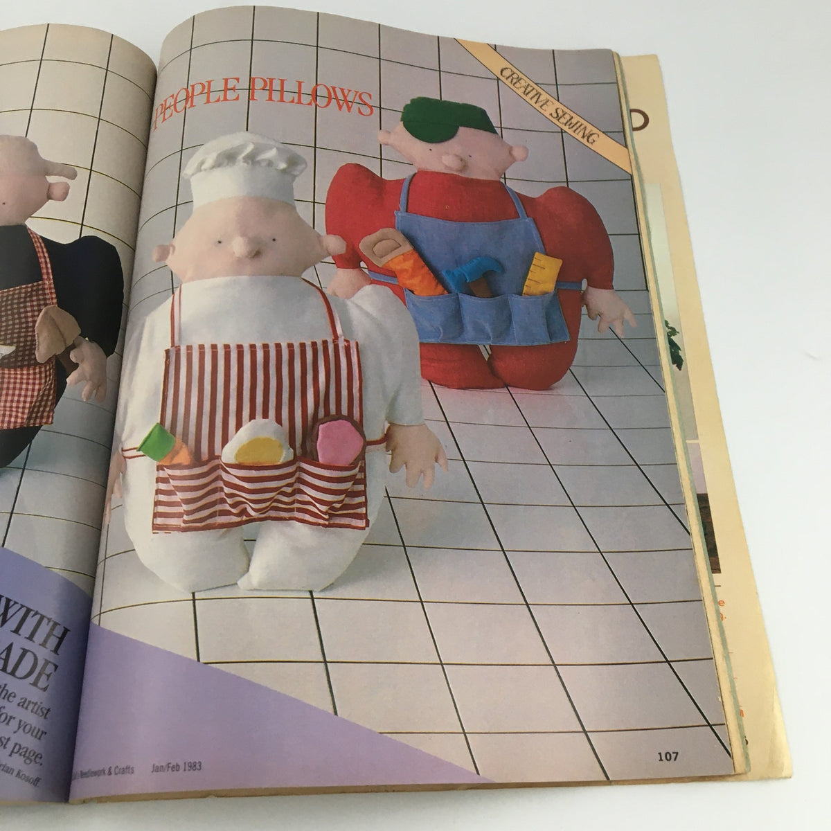 Page from McCall's Needlework & Crafts Magazine February 1983 featuring creative plush pillow designs, showcasing whimsical characters with vibrant colors and textures.
