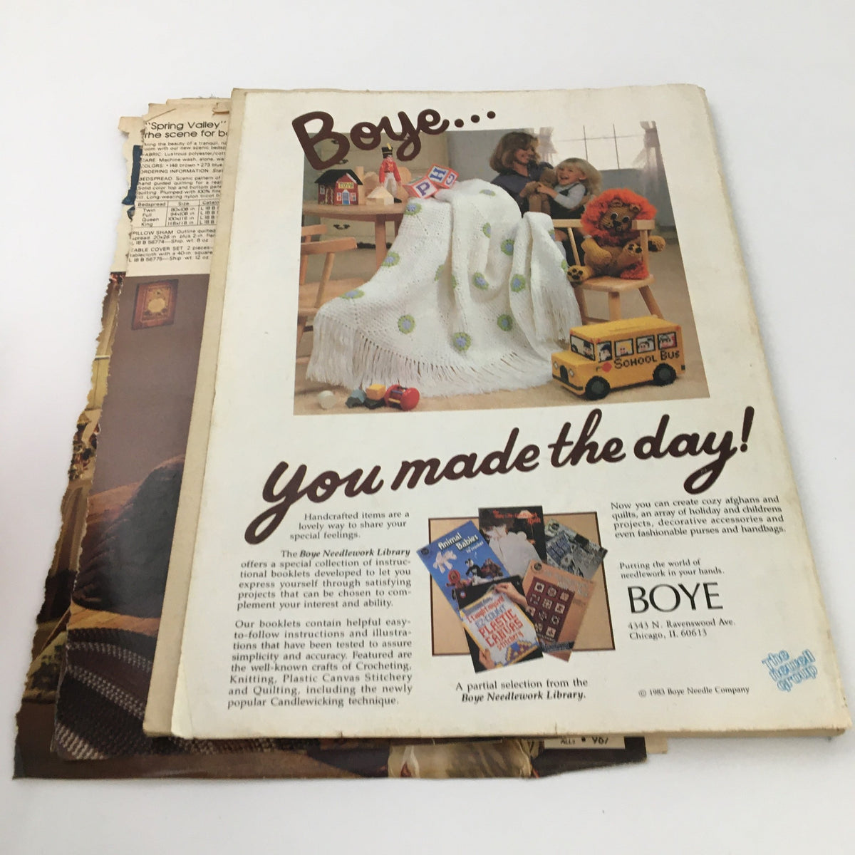 Cover image of McCall's Needlework & Crafts Magazine from February 1983 featuring a Boye advertisement, showcasing handcrafted items and a cozy indoor scene with children. This issue highlights country crafts and includes detailed instructions for various needlework techniques.