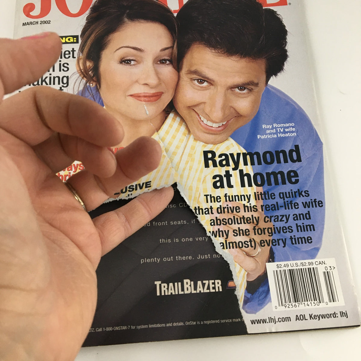 Close-up of Ladies' Home Journal Magazine March 2002 cover with Ray Romano and Patricia Heaton, highlighting wear and tear and a featured article 'Raymond at Home'.