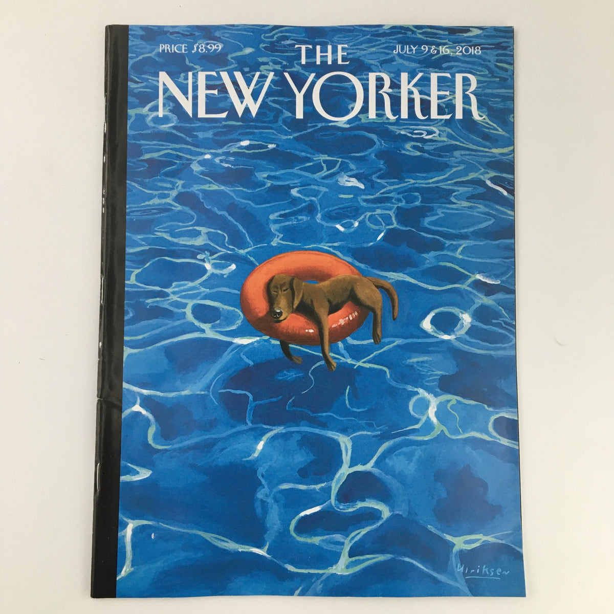 The New Yorker July 9 & 16, 2018 cover featuring a dog relaxing on a lifebuoy in a vibrant blue swimming pool, illustrated by Mark Ulriksen.