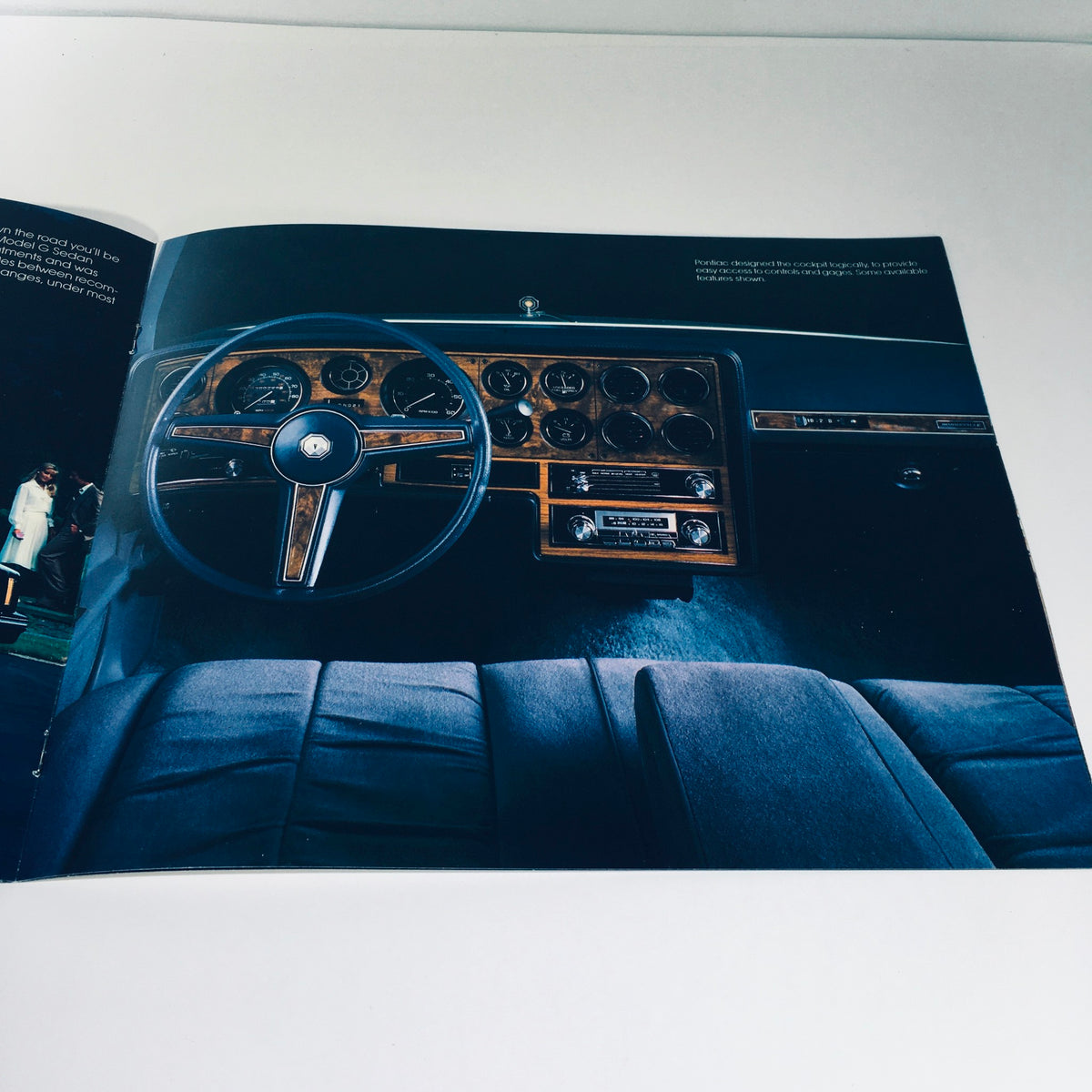 Dashboard view of the 1982 Pontiac Bonneville Model G Brougham 4-Door Sedan Car Sales Brochure highlighting the classic instrument panel and controls.