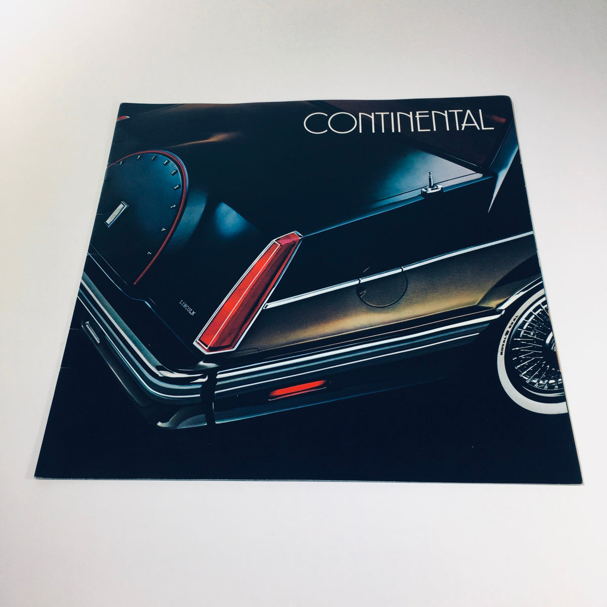 Cover of the 1982 Lincoln-Mercury Division Continental Givenchy Designer Series Car Brochure displaying the sleek back of the vehicle.
