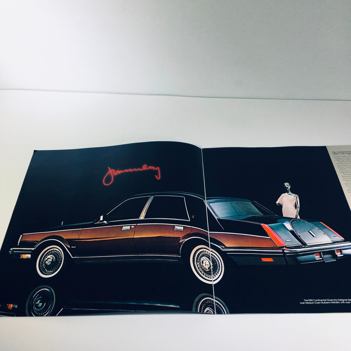 Inside spread of the 1982 Lincoln-Mercury Division Continental Givenchy Designer Series Car Brochure featuring a stylish car and model.