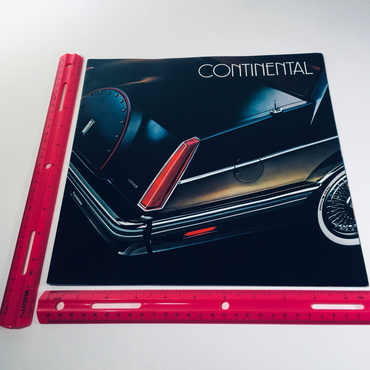 Back cover of the 1982 Lincoln-Mercury Division Continental Givenchy Designer Series Car Brochure with ruler for size reference.