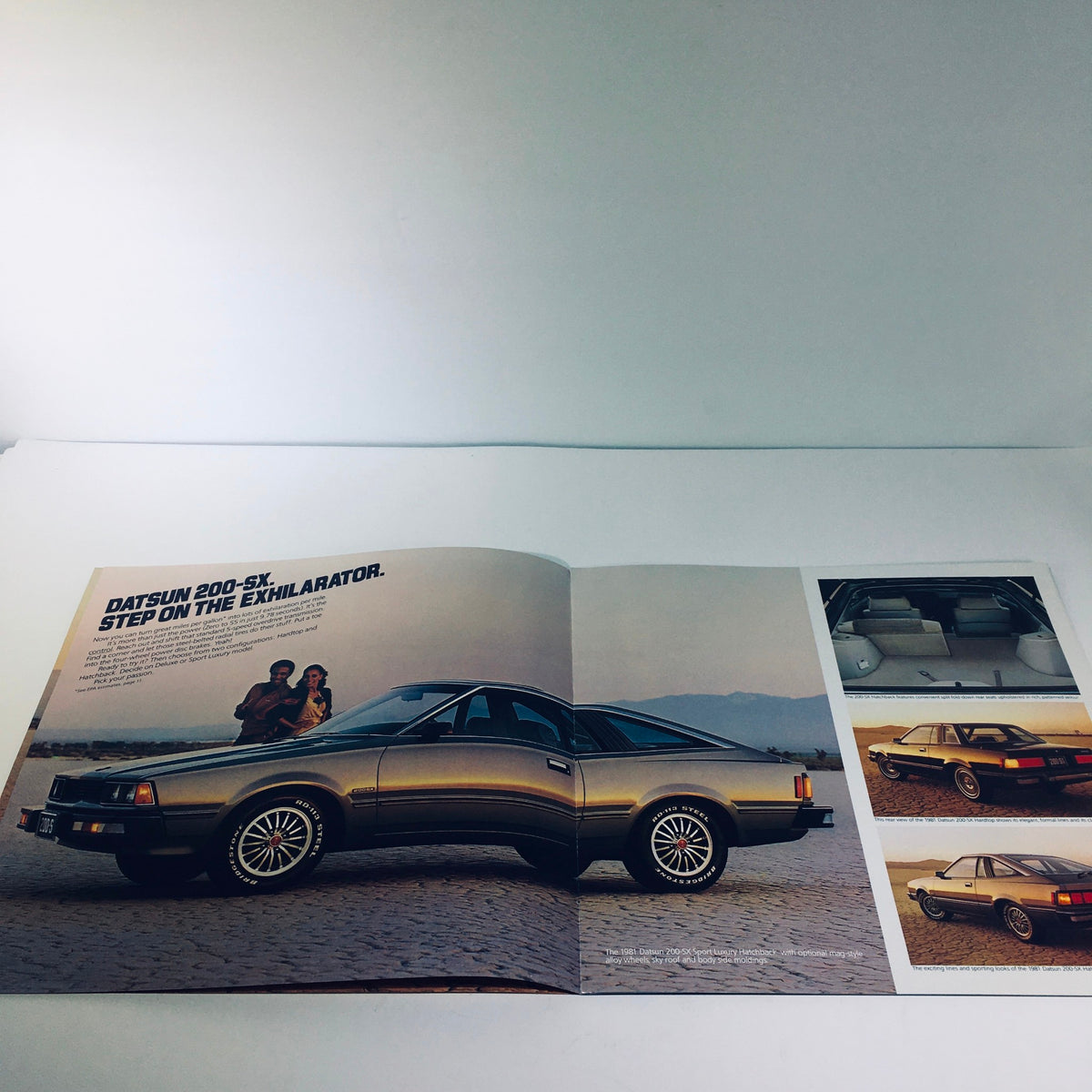 1981 Datsun 200-SX by Nissan Fuel Injected NAPS-Z Car Sale Brochure showcasing the car's elegant exterior with a couple standing beside it, emphasizing its design and features.