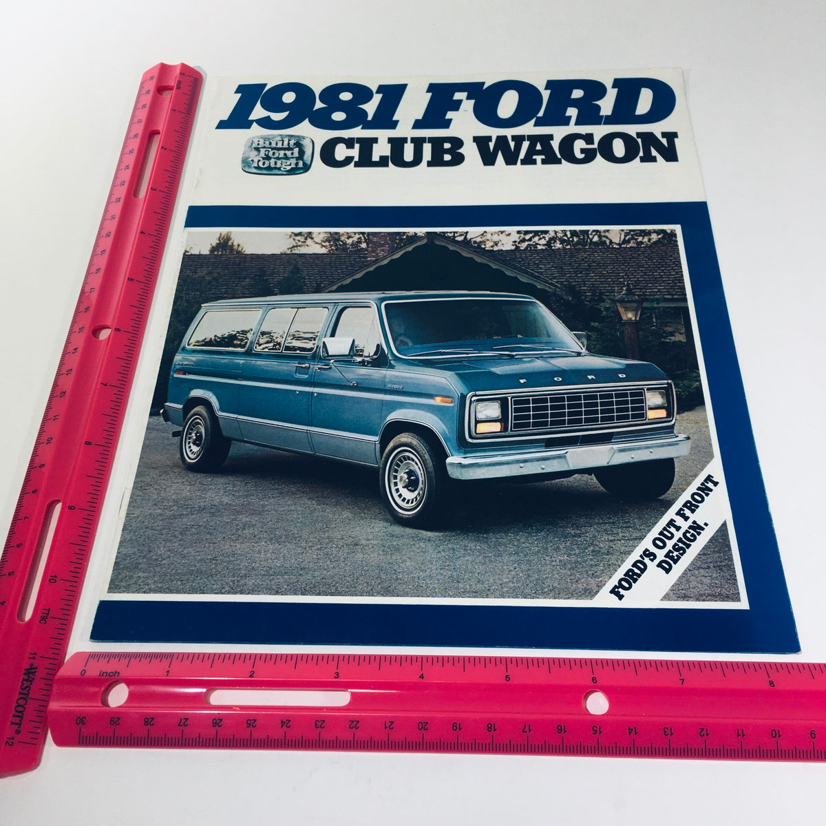 1981 Ford Wagon Club Wagon V-8 300 CID 6 4-Speed Manual Car Sale Brochure featuring a blue Ford Club Wagon parked in front of a house, with a ruler for size reference.
