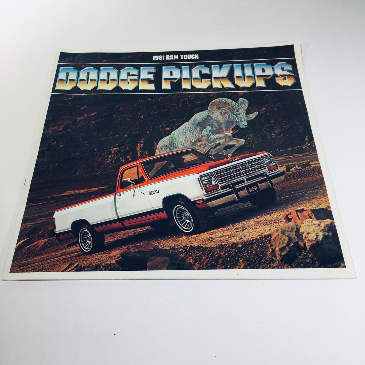 1981 Dodge Pickups D350 Crew Cab Ram Royal Two-Barrel V-8 Engine Car Brochure featuring a stylish Dodge pickup truck in a rugged landscape setting with a ram illustration.
