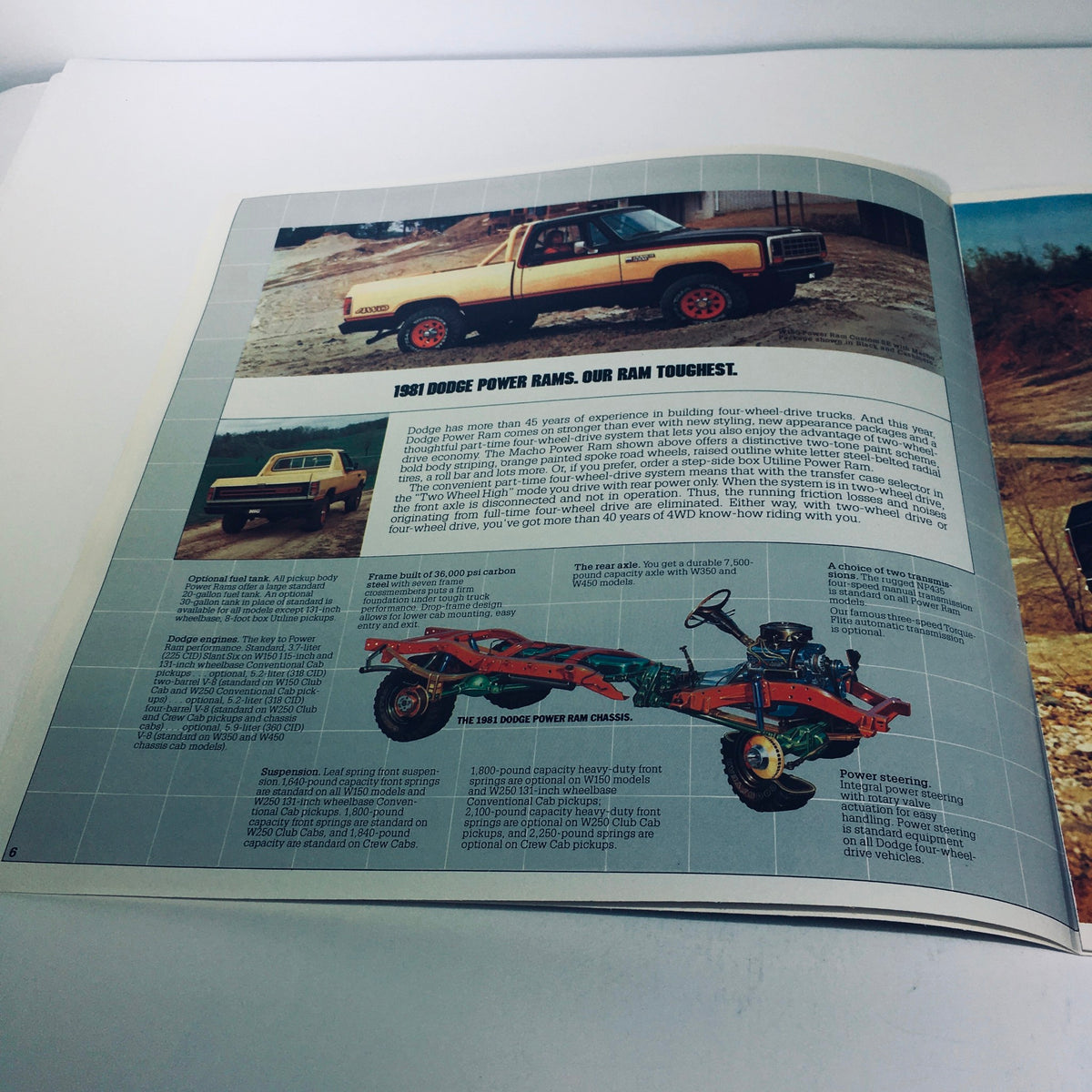 1981 Dodge Pickups D350 Crew Cab Ram Royal Two-Barrel V-8 Engine Car Brochure page showcasing a yellow D350 truck in a rugged outdoor setting, highlighting its features and design.