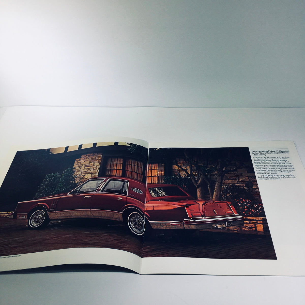 Interior page of the 1981 Continental Mark VI Signature Series brochure showcasing the car parked elegantly outside a luxurious home.