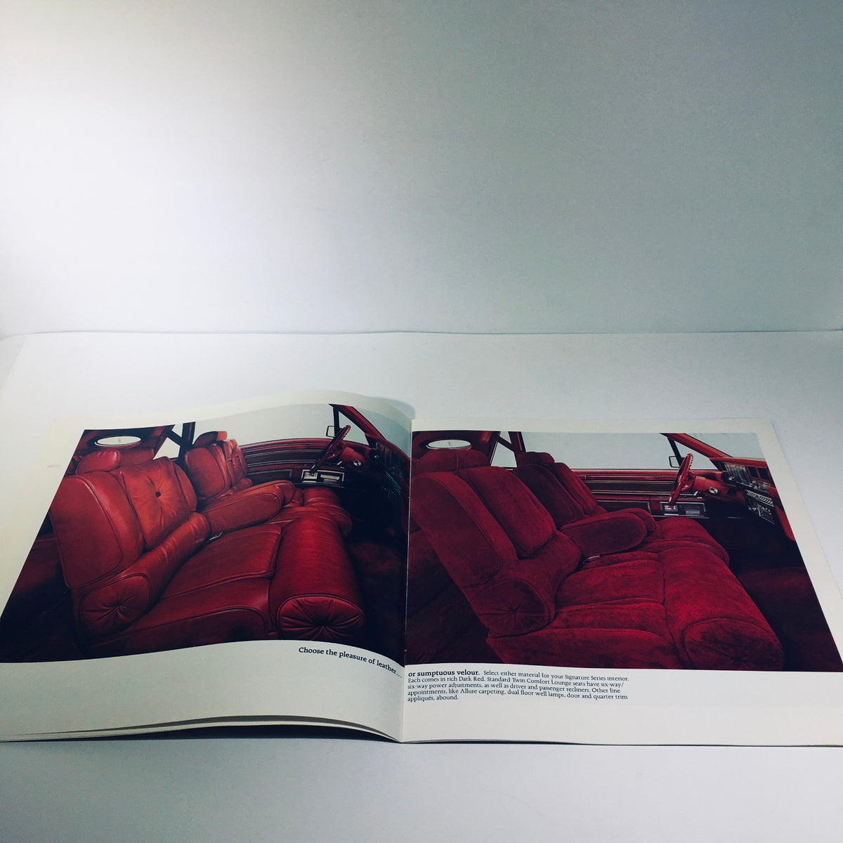 Interior page of the 1981 Continental Mark VI Signature Series brochure displaying the plush red seating and sophisticated dashboard.