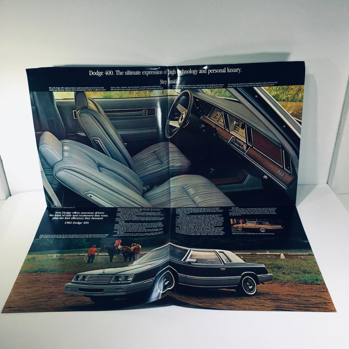 Interior view of the 1982 Dodge 400 car sale brochure, depicting the luxurious seating and dashboard design, exemplifying personal luxury.