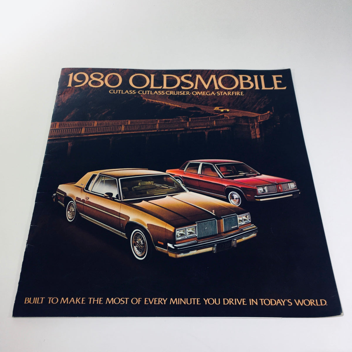 1980 Oldsmobile Cutlass, Cutlass Cruiser, Omega, Starfire V8 Power Car Brochure cover featuring classic cars, highlighting the design and features of the vehicles with the tagline 'Built to make the most of every minute you drive in today's world'.