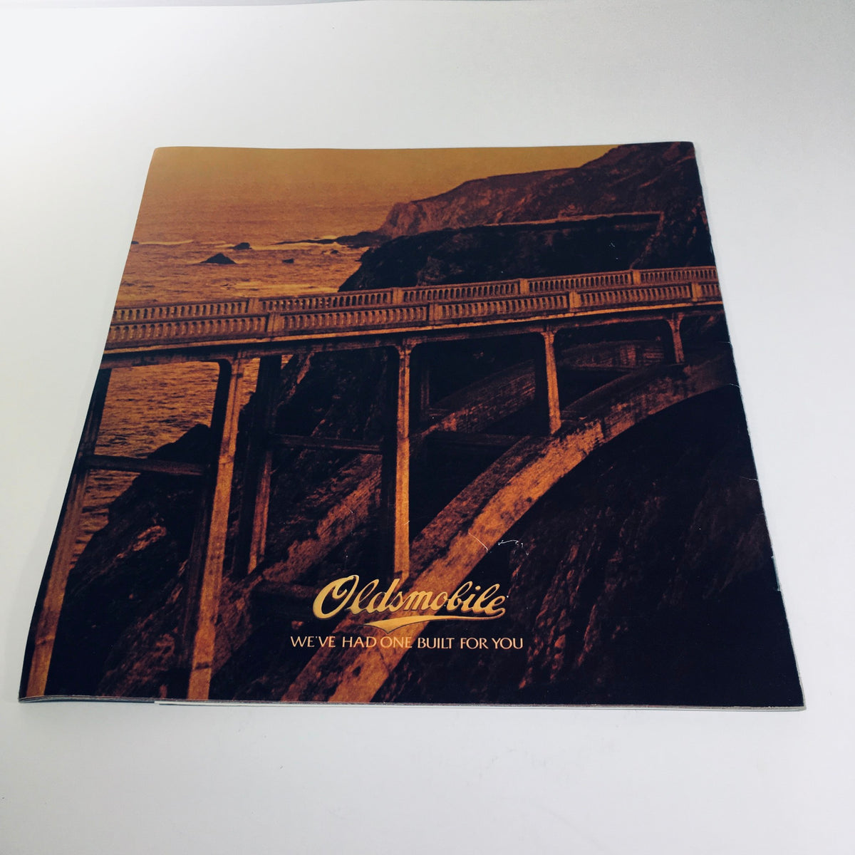 Cover of the 1980 Oldsmobile Cutlass brochure with scenic imagery, displaying the tagline 'We've Had One Built for You'.