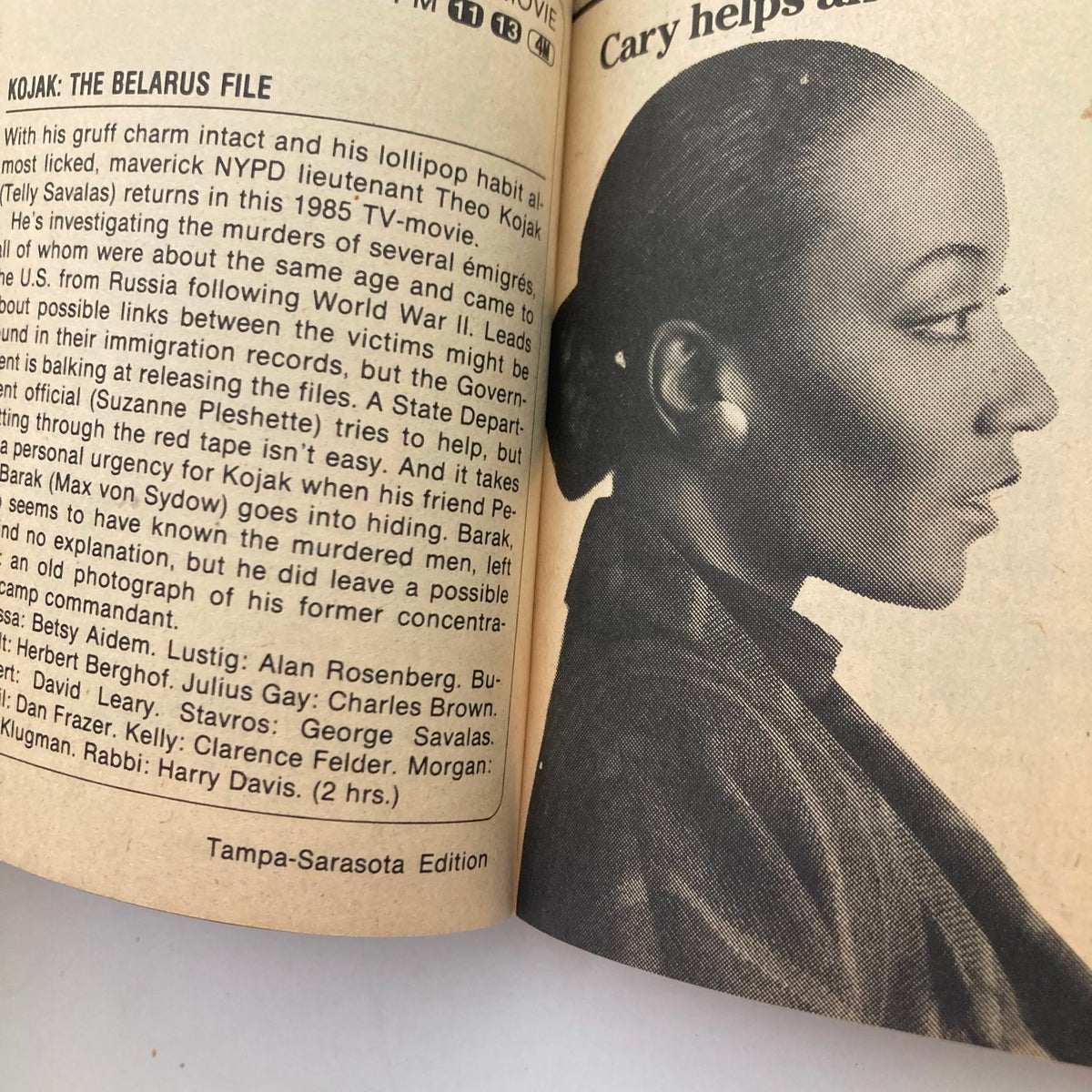 Interior page of TV Guide Magazine February 16, 1985, showcasing the article 'Kojak: The Belarus File'. Features a profile image of a character from the TV show, along with a detailed summary.
