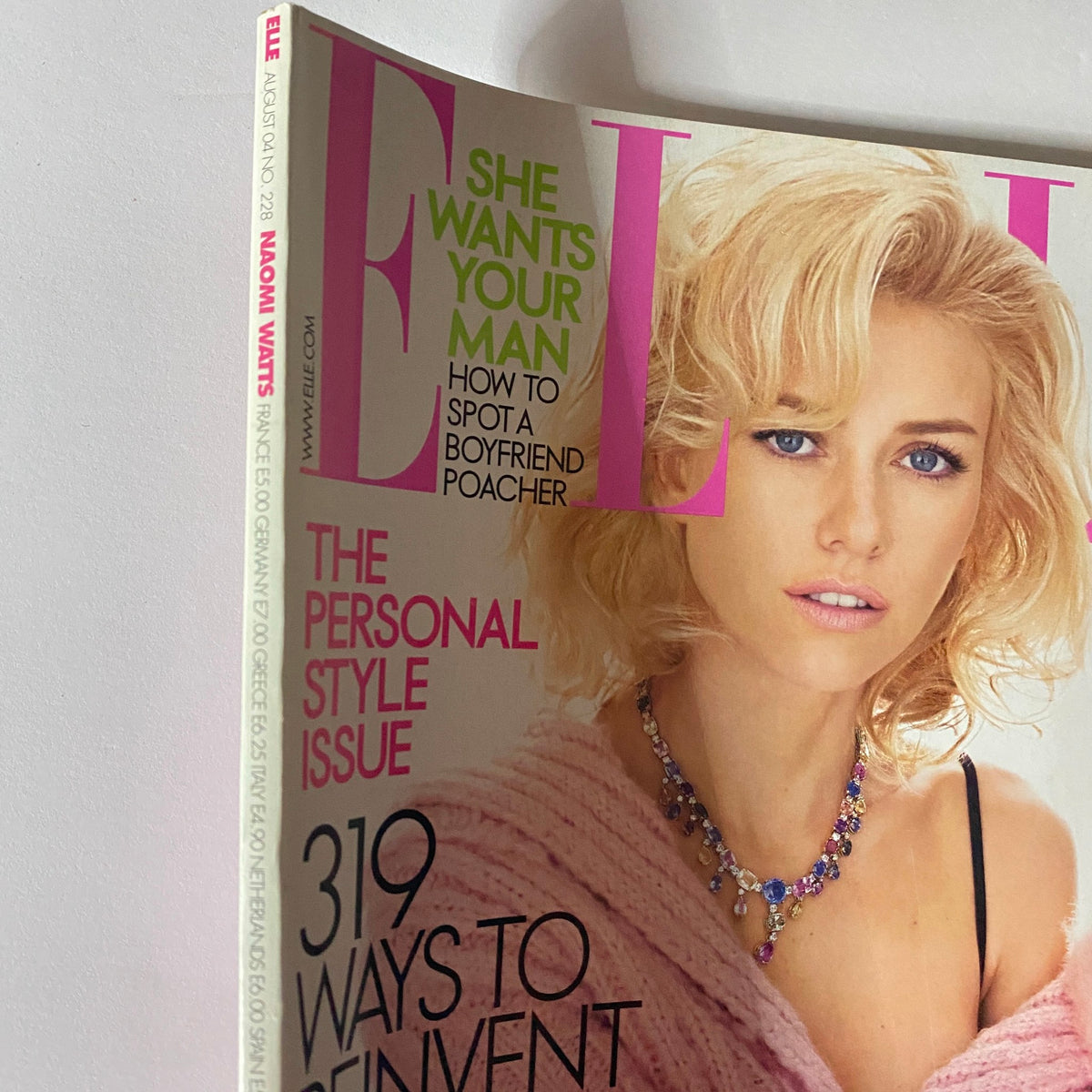 Close-up view of the Elle Magazine August 2004 cover with Naomi Watts, highlighting the magazine's intriguing tagline and fashion details.