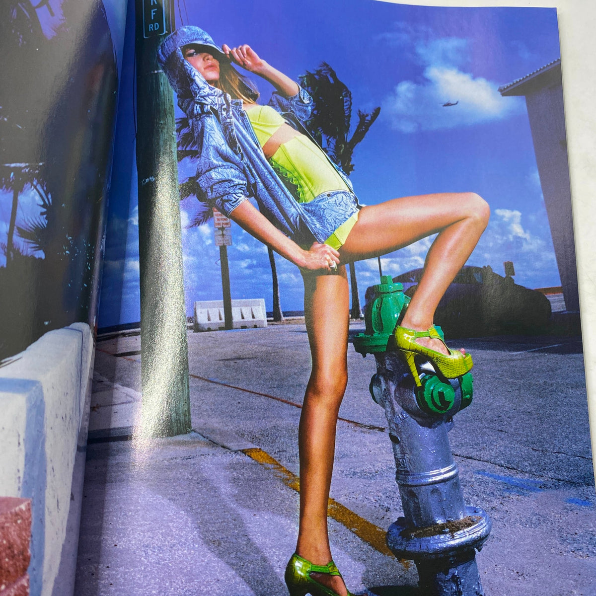 Fashion editorial from Elle UK Magazine April 2007, highlighting striking summer outfits against a vibrant backdrop.