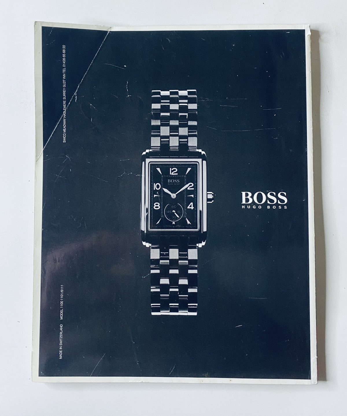 Back cover of CAR Magazine April 2001 showcasing a Hugo Boss wristwatch, highlighting the brand's luxury and design.